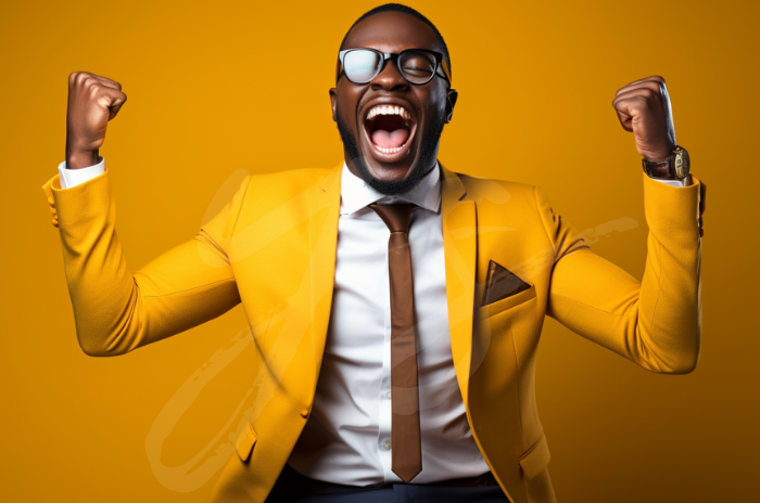 A joyful man in a yellow suit with sunglasses, shouting in excitement and raising his fists against a yellow background.